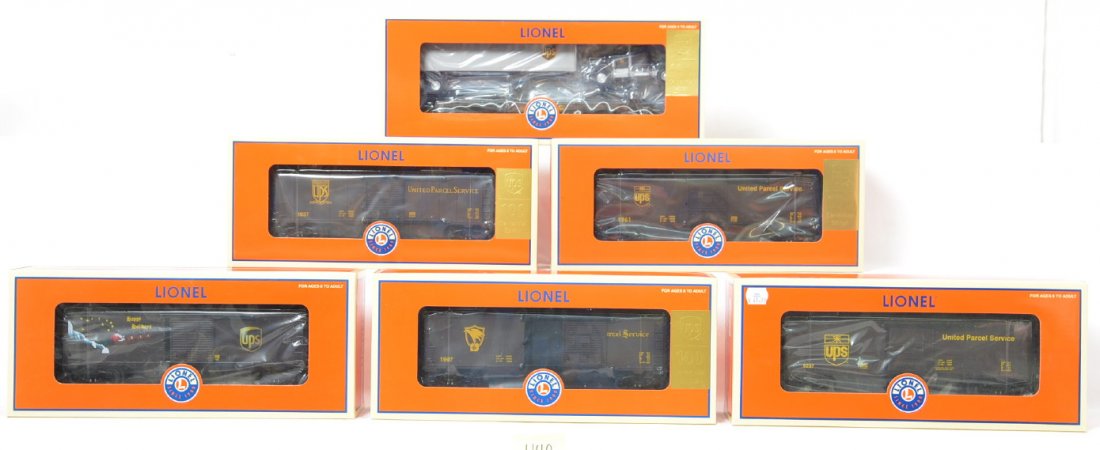 6 Lionel UPS freight cars 26829, 26827, 25041 39296: Lionel modern O gauge UPS freight cars in OBs. Eight cars include 39475 flat with trailer, 26829 operating holiday boxcar, 26827 operating boxcar, 25042 Centennial boxcar, 39296 commemorative boxcar #