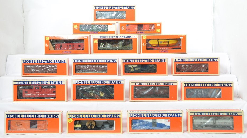18 Lionel freight cars 6117, 6306, 16970, 19704, etc: Lionel modern O gauge freight cars in OB. Eighteen freight cars include 6917 Jersey Central caboose, 19704 Western Maryland caboose, 16726 Army ladder car, 16970 LA County flat with boat, 19732 Santa 