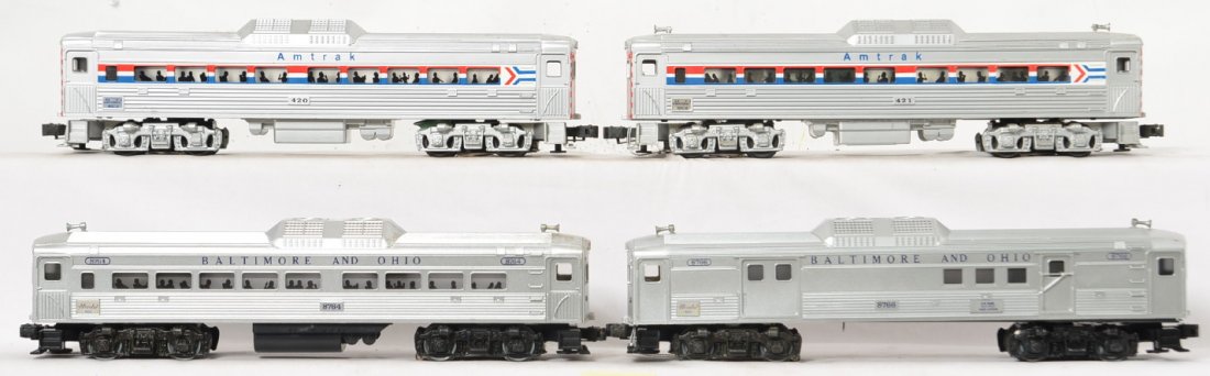 4 Lionel and Williams Amtrak and B&O RDC cars: Lionel and WIlliams modern O gauge RDC cars. Includes Lionel Baltimore and Ohio 8764 and 8766. Williams Amtrak cars are 421 and 420. Both sets are C6-7 with some dirt and small scratches. Should clean