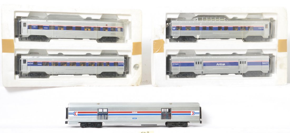 Railking and K line Amtrak passenger cars: Railking and K Line modern O gauge Amtrak passenger cars. Includes Railking four car set in inner cartons, and aluminum Amtrak 18 inch baggage car without box, and one bent number plate. Trains are C7