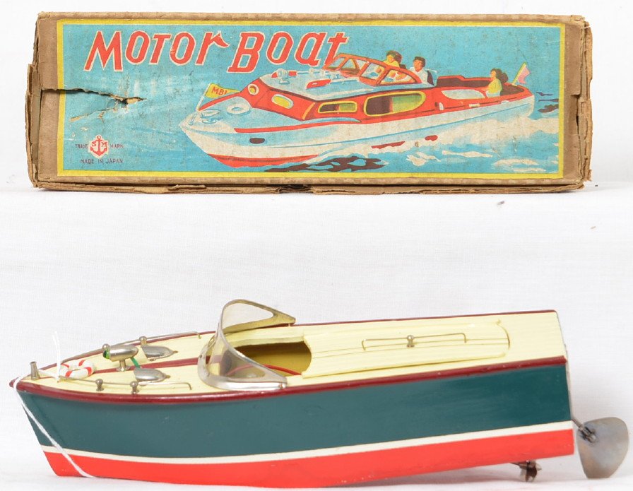 Vintage Japan toy Motor Boat in OB: Super nice 10 5/8â€ long boat in original box, runs off of one C or D cell battery, it has not been tested for operation. The boat is in fantastic shape but may be missing a flag from the front end