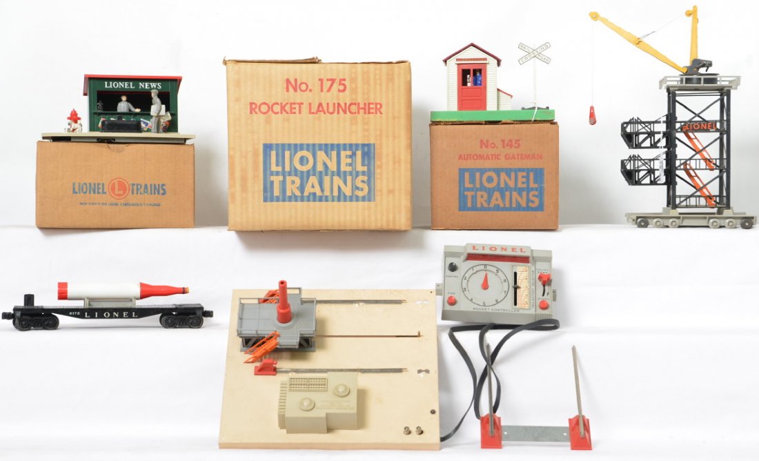 Lionel Postwar 128 145 175 accessories in OBs: Lot includes 128 newsstand with 364c and original instruction sheet in C7, 145 automatic gateman with some base wear and tape residue, C6, and a 175 rocket launcher in need of a good cleaning but appe