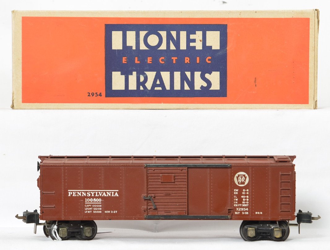 Lionel prewar O gauge semi scale 2954 boxcar, in OB: Lionel prewar O gauge 2954 semi scale Pennsylvania boxcar with high box couplers in a very nice original box with insert. Car has minor paint wear and one chipped step but otherwise nice and clean, C7