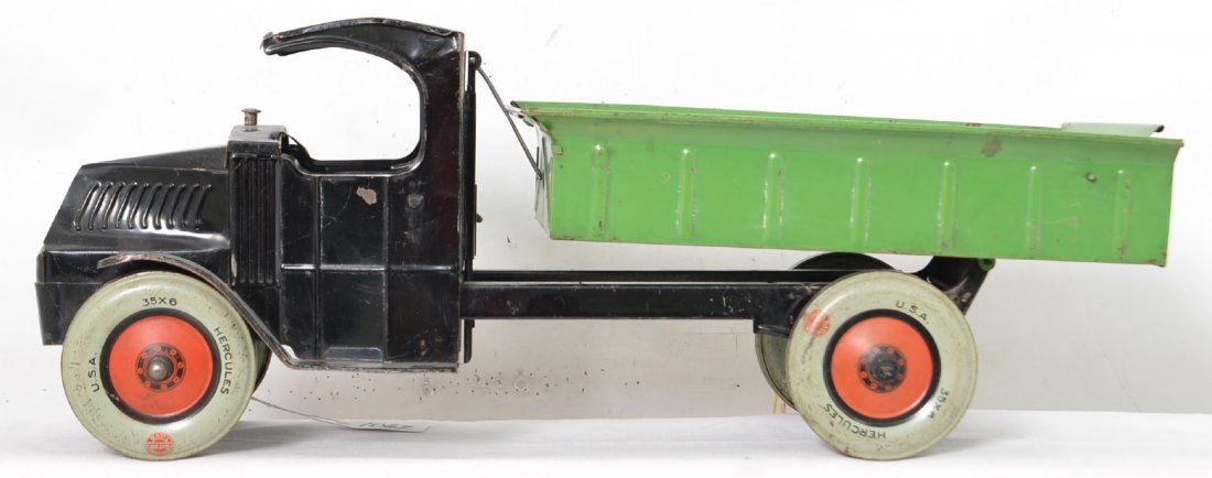 Chein Hercules Mack ratcheting dump truck: 1930â€™s Chein Hercules ratcheting Mack dump truck. Truck is missing the steering wheel and original metal latch that attaches the lift to the bed. The crank action worked but there must be some 