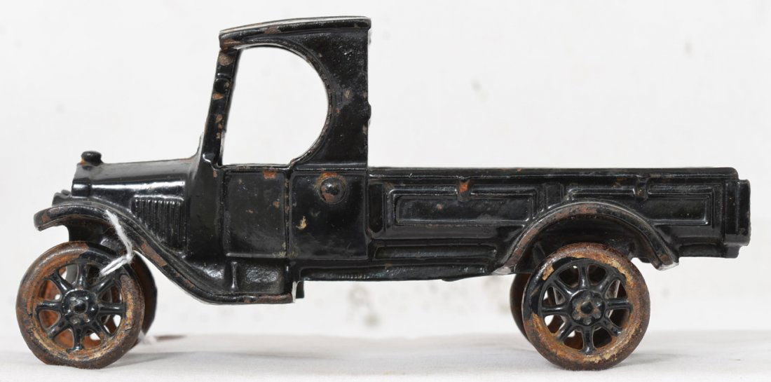 Arcade cast iron Ford model T flat bed truck: All original Arcade cast iron Ford model T flat bed truck. Missing a lot of paint from the wheels but the rest of the truck retains 95% or more of the original paint, missing the driver.