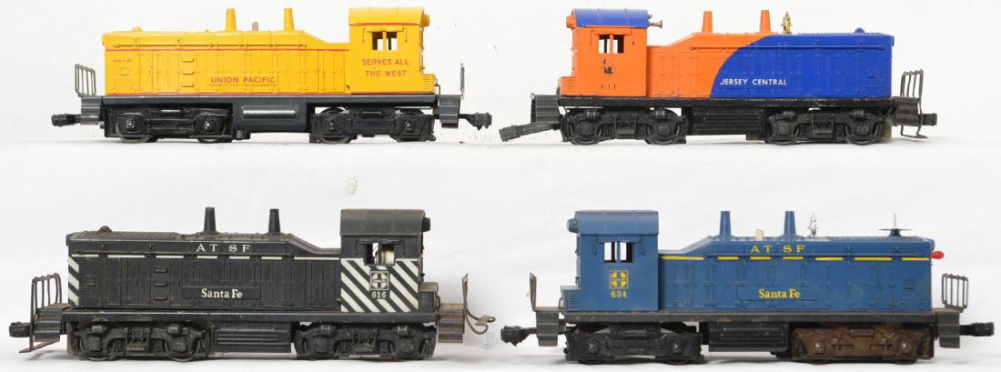 Group of Lionel postwar switchers 611 616 634 635: Includes 611 Jersey Central, 616 Santa Fe, 634 Santa Fe and 635 Union Pacific. 611 and 616 shells are loose from the frame due to screw damage (missing chunk where screw should be) and 634 appears to
