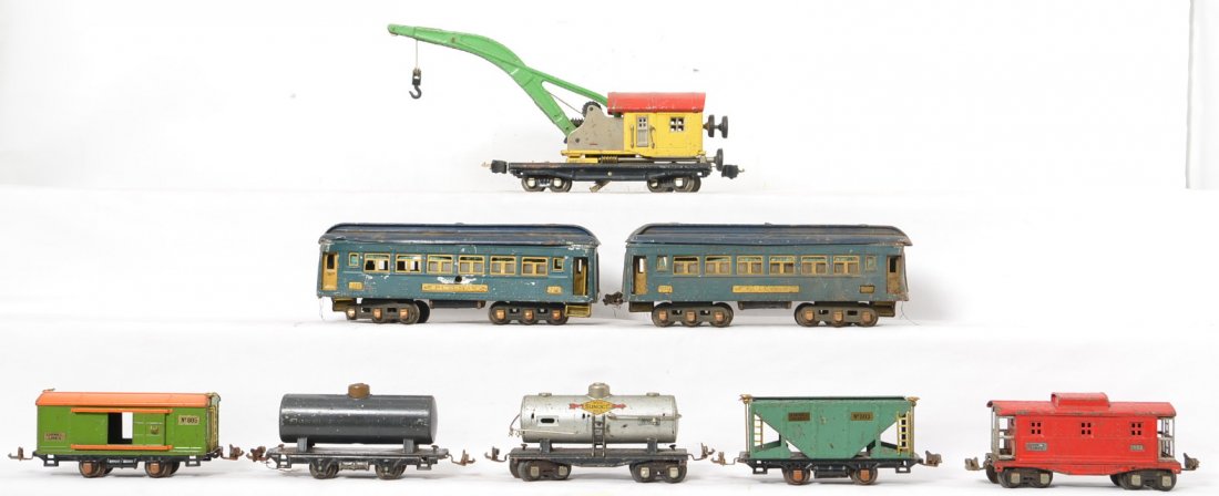 Lionel prewar cars 710, 810, 803, 804, etc.: Lionel prewar O gauge misc. cars including two 710 passenger cars, 810, 654, 803, 805, 804, 657. Sold as is shown in the photos.