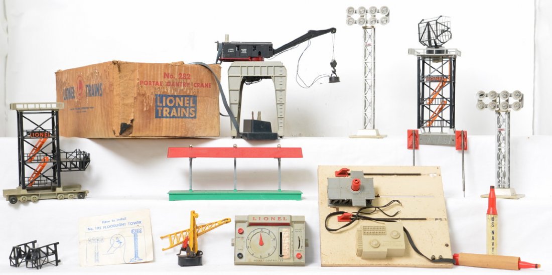 Lionel Postwar O gauge 282 gantry crane in OB & other: Group of Lionel Postwar O gauge accessories including a 282 portal gantry crane in box with controller, 197 radar tower, 175 rocket launcher, 195 floodlight and a modified 195 floodlight and MPC 2256 