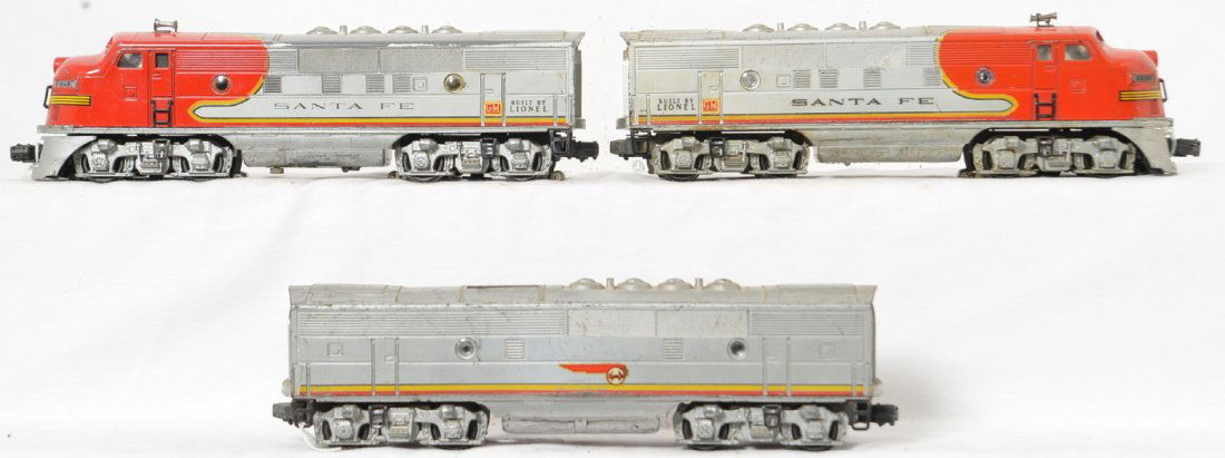 Lionel Postwar O gauge 2343 Santa Fe F3 A-B-A: Lionel Postwar O gauge 2343 Santa Fe F3 A-B-A set with considerable run time, play wear and scratches. The battery box is OK inside but there is corrosion on the belly, the shell is loose on the power