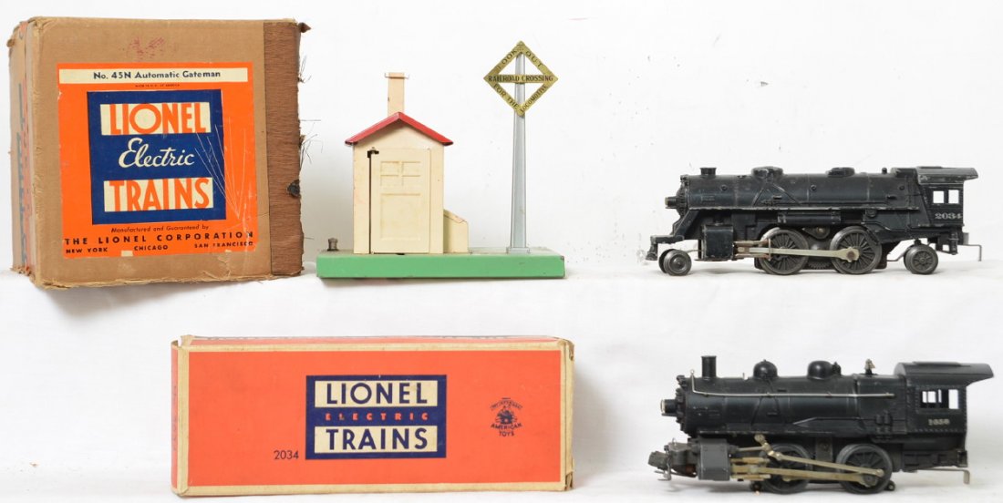 Lionel Postwar O gauge 2034 1656 steam locomotives 45N: Lionel Postwar O gauge 1656 0-4-0 switcher, 2034 2-4-2 steam locomotive and 45N automatic gateman in original box. Switcher is nice an clean with low run time, C6-7, 2034 has play wear and moderate ru