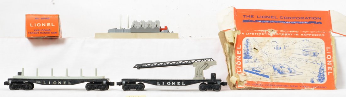 Lionel Postwar O gauge military and space related items: Lionel Postwar O gauge 6844 and 6512 flat cars, 6448 exploding box car and a 448 missile firing range set. 6512 cherry picker car is missing the bucket and astronaut and the 6844 is missing the missil
