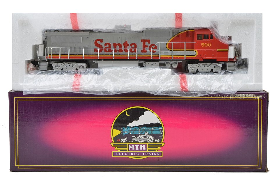 MTH SF BW no. 500 GE Dash-8 40 Diesel OB: MTH Santa Fe BW no. 500 3-rail General Electric Dash-8 40 diesel in OB. One end of the diesel has a tiny chip by the hand rail, otherwise diesel is C7.