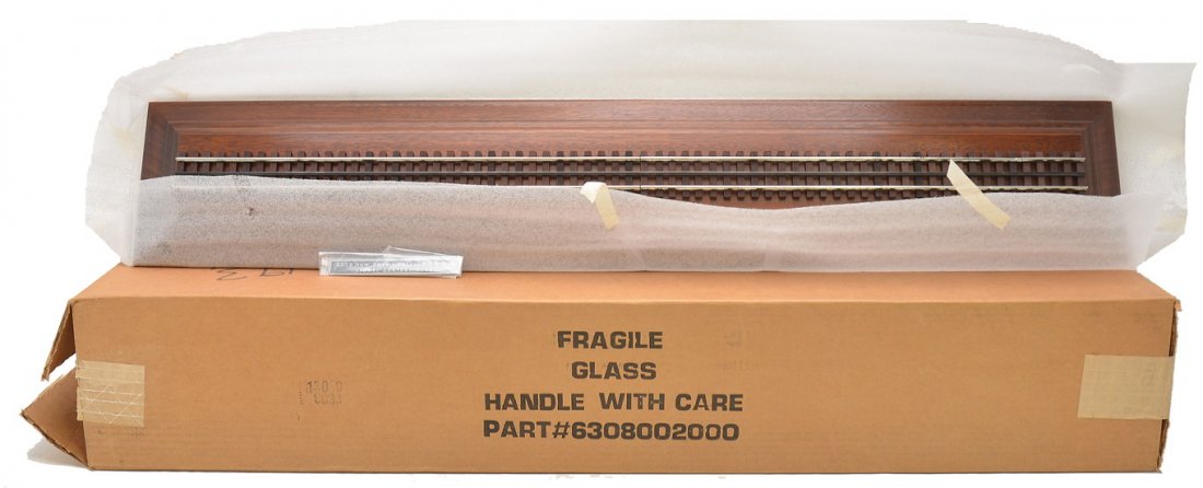 Lionel Century Club no. 6308002000 Display Case: Lionel Century Club part no. 6308002000 display case for the 2333 NYC F3 ABA diesel units in OB. The display case is factory new, however the track on the wooden board has surface corrosion.