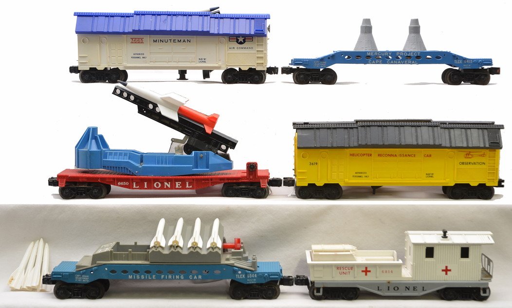 Lionel Military 3665 3619 6413 6650 6544 6814: Lionel military freight cars including; 3665 U.S. Air Force Minuteman operating car with rocket, 3619 helicopter reconnaissance car missing the helicopter and with a broken roof hinge, 6413 Mercury Ca