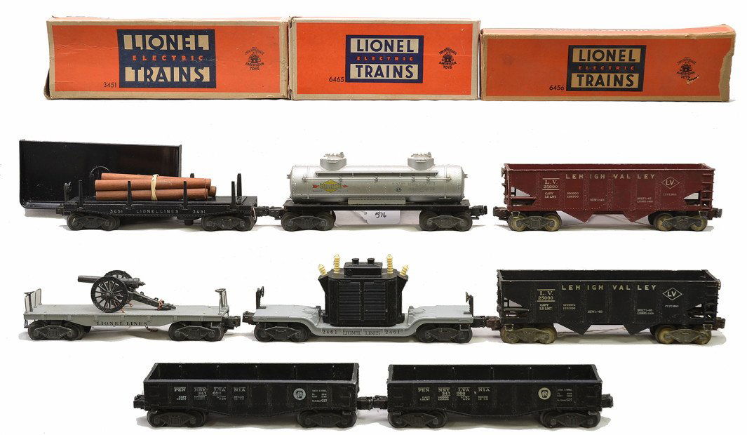 Lionel Freights 2461 3451 6465 2452X 2411 6456: Lionel freight cars including; 2461 transformer car with black transformer, 3451 automatic lumber car with 160 tray and five wooden logs in OB, 6465 Sunoco two dome tank in OB, two 2452X Pennsylvania