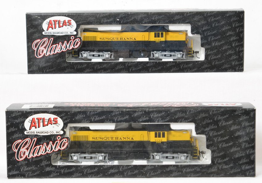 Atlas Susquehanna Alco RS-1 pair: Atlas modern HO Susquehanna Railroad RS-1 Alco diesel locomotives in OBs. Catalog numbers 8868 and 69. Locos are C8-9 with light run time. OBs have some very light wear. Both locos equipped with Kadee