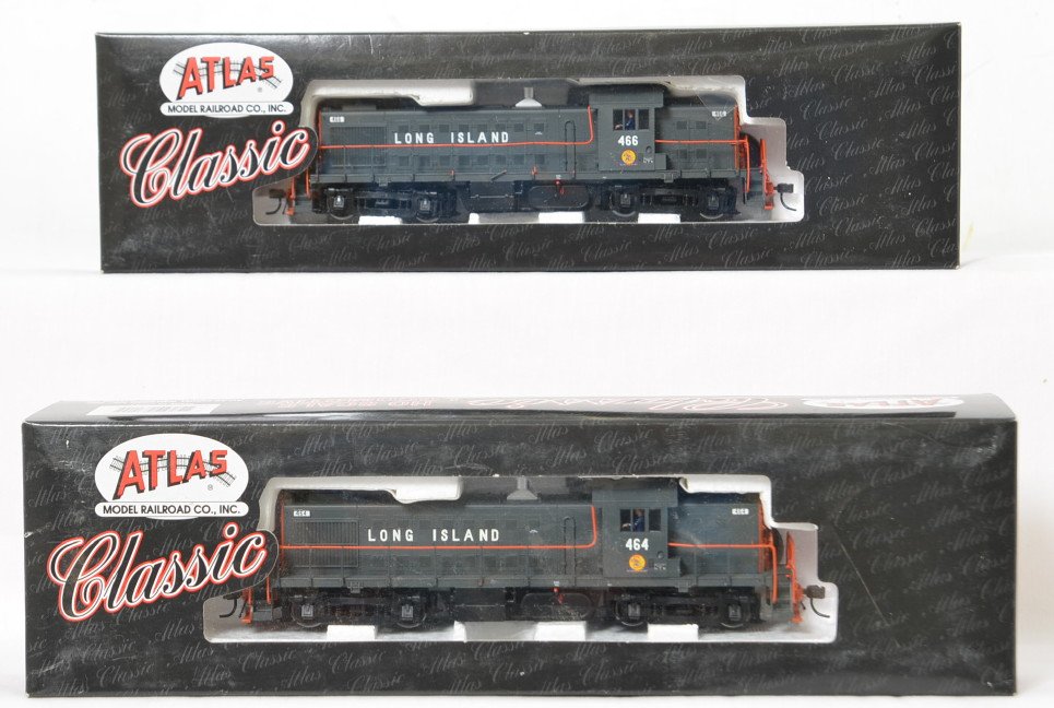 Atlas Long Island Railroad Alco RS-1 pair: Atlas modern HO Long Island Railroad RS-1 Alco diesel locomotives in OBs. Catalog numbers 7115 and 16. Locos are C7-8 with light run time however a few broken hand rails noted. OBs have some very ligh