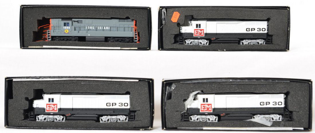4 Bachmann Spectrum EMD GP30s and Long Island: Bachmann Spectrum modern HO diesel locomotives in OBs. Includes three 82000 EMD GP30Ã•s and custom Long Island Railroad FM Trainmaster. GP locos are C8 to C10, Trainmaster is C7-8 with some chippin