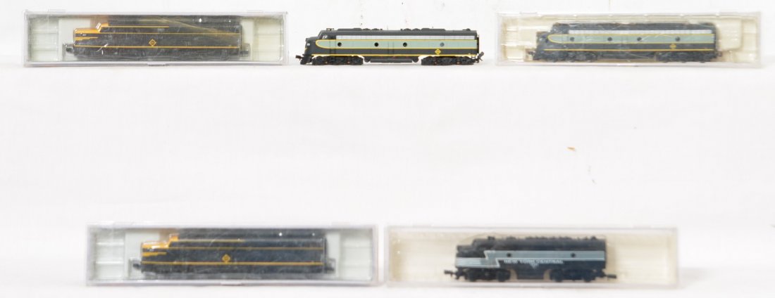 5 N scale locos NYC, Erie, E8, F7, etc: Life Like modern N scale diesel locomotives. Four of five are in OBs. Includes 7738 New York Central F-7, 7053 and 7054 Erie Alco PA A-A, and 7187 and 88? Erie E8 A-A, one box missing. Locos are gener