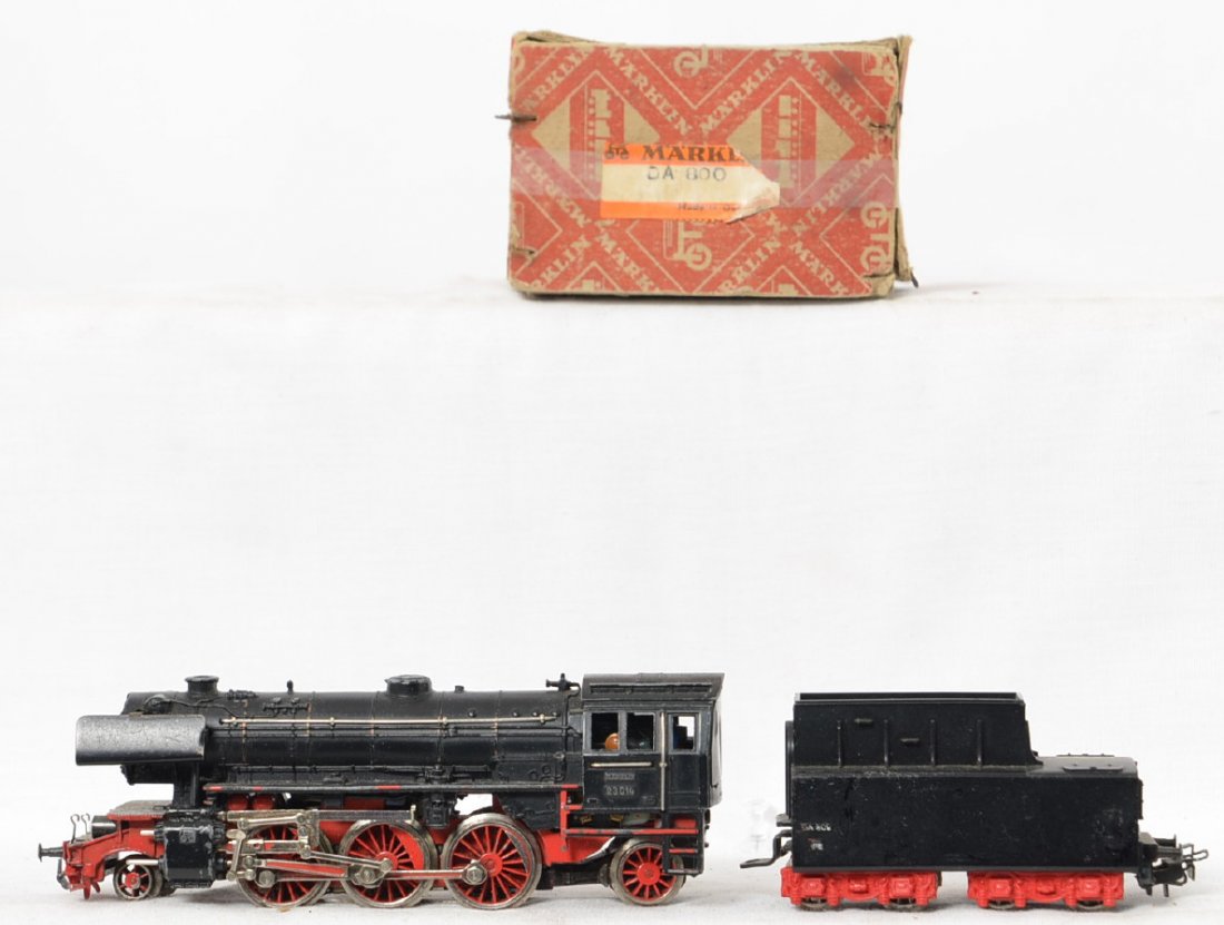 Marklin DA 800 steam locomotive in OB: Marklin HO DA 800 2-6-2 steam locomotive in OB. Locomotive is C7 with one slightly bent smoke lifter and a few light spots of wear. OB has tape repairs but is complete.
