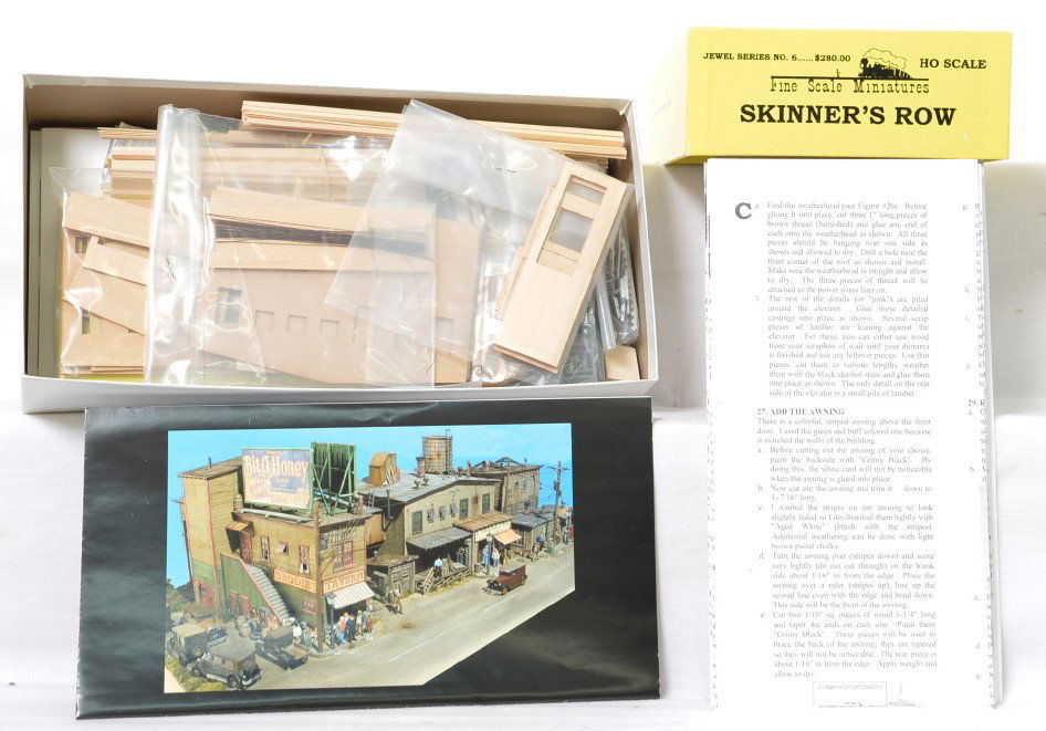 Fine Scale Miniatures No. 6 Skinners Row kit: Fine Scale Miniatures modern HO building kit in OB. Kit is Jewel Series No. 6 Skinners Row. Kit is new in box C10 with bags sealed. OB has some light wear and two small pieces of tape.