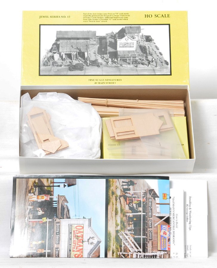 Fine Scale Miniatures No. 12 OatmanÃ•s Mercantile kit: Fine Scale Miniatures modern HO building kit in OB. Kit is Jewel Series No. 12 OatmanÃ•s Mercantile. Kit is new in box C10 with bags sealed. OB has some light wear and two small pieces of tape.