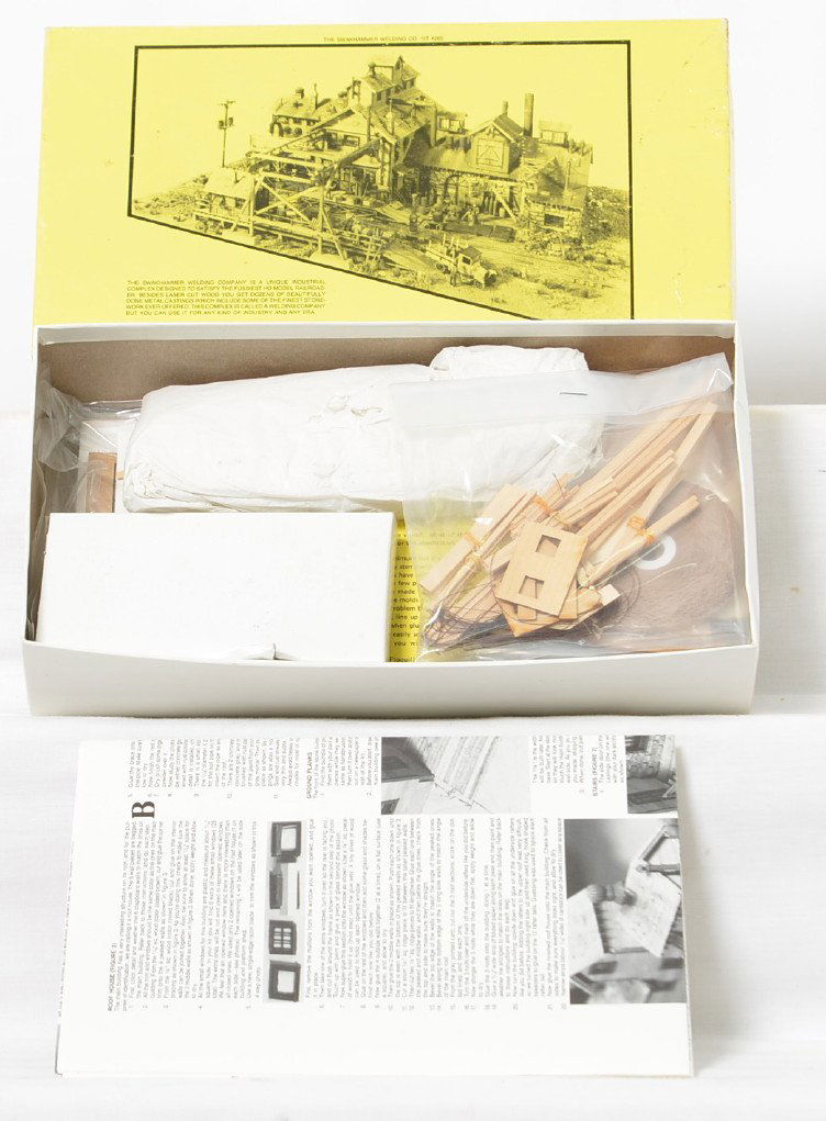 Fine Scale Miniatures 265 SwakhammerÃ•s Welding kit: Fine Scale Miniatures modern HO building kit in OB. Kit is number 265 SwakhammerÃ•s Welding Company. Kit is new in box C10 with sealed bags. OB lid has two clear pieces of tape.