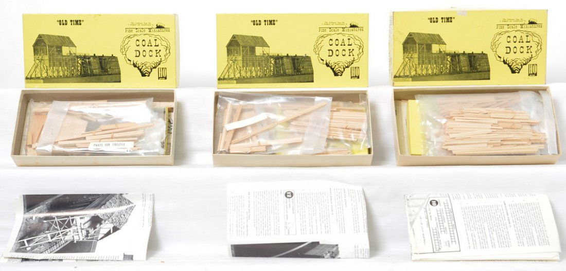 3 Fine Scale Miniatures 155 Coal Dock kits: Fine Scale Miniatures modern HO building kits in OBs. Three number 155 Coal Dock kits. Kits appear to be complete C9-10. OBs have light wear and price stickers.