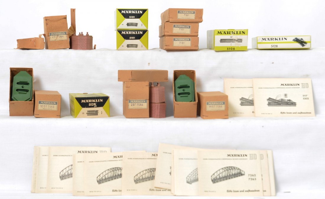 Marklin instruction manuals, boxes, and bridge piers.: Marklin modern HO instruction manuals, boxes, and more. Includes 33 instruction manuals for bridges, turntable, switches, and more. Empty boxes for three 7161, 5128, 5106, 5101, 5101, and the followin