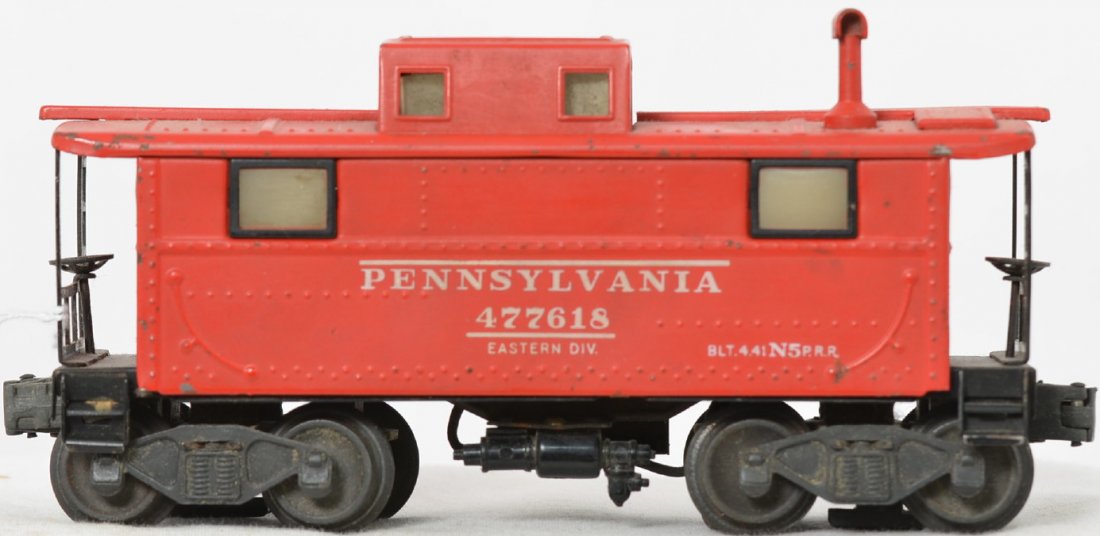 Lionel Postwar O gauge 2457 caboose whirly wheels: Lionel Postwar O gauge 2457 caboose, red with matching smoke stack, black window frames, whirly wheels and a flying shoe. This came in a 224E set from 1945 after WWII had ended.