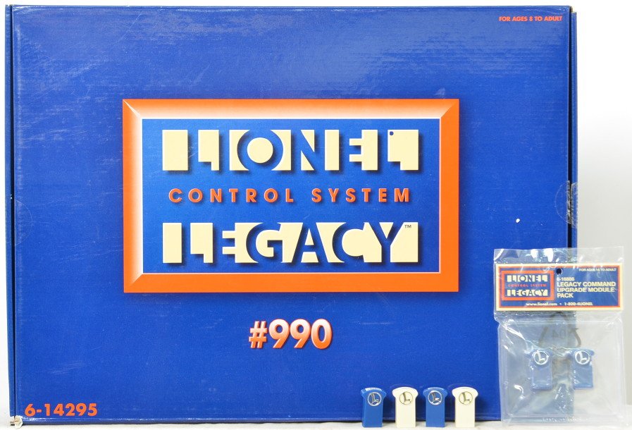 Lionel Legacy 14295 990 control set: Lionel modern O gauge 14295 Legacy #990 control set. Set features Cab II remote and command base. Set is missing batteries and blue modules. Layout used C8.