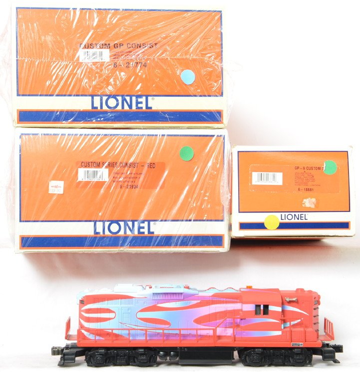 Lionel Hot Rod GP-9 and cars 18881 21934 21774: Lionel modern O gauge Hot Rod custom GP-9 loco and cars. Includes 18881 series II GP-9 with TMCC and Railsounds in C8 condition. Also included is 21934 red freight set and 21774 blue freight set. Both