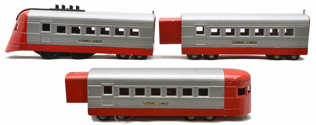 Lionel Aluminum/Red Passenger Set no. 1065E: Lionel prewar O gauge streamlined aluminum and red passenger set no. 1065E, circa 1935 including; 1700E loco, 1701 coach and 1702 observation. The set has nickel journals and is C6-7.