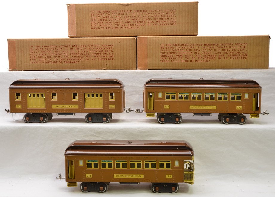 Lionel 2-Tone Brown Baby State 310 309 312: Lionel prewar standard gauge set of two-tone brown Baby State passenger cars with cream inserts and copper journals in OBs including; 310 baggage, 309 Pullman and a 312 observation. The cars are C8, e