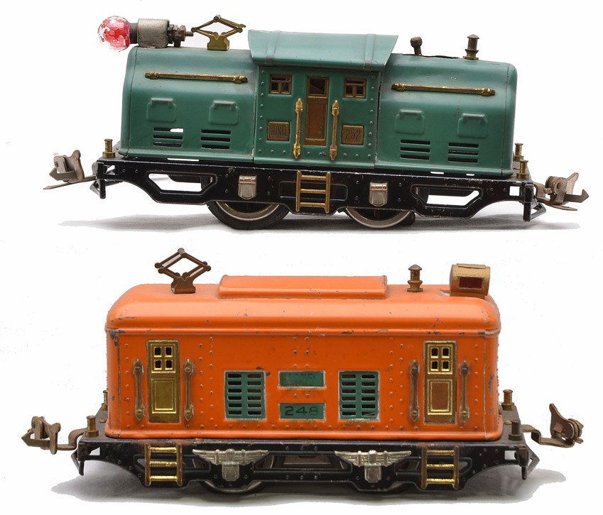 Lionel 248 Orange 252 Peacock Electric Locos: Lionel prewar O gauge 248 orange electric loco with peacock inserts, brass trim and nickel journals and a 252 peacock electric loco with brass trim and nickel journals. The wheels on the 248 are start