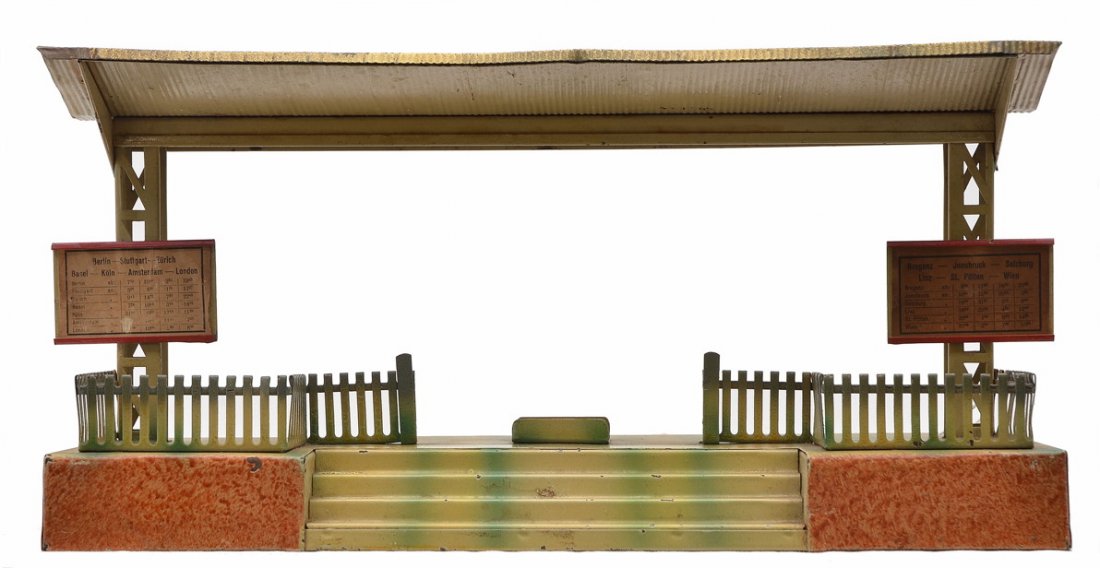 Doll & Cie 1 Gauge Litho Pass Waiting Platform: Doll & Cie prewar 1 gauge lithographed passenger waiting platform with two original train destination signs. The ticket stand is missing from the center. Platform is C7.