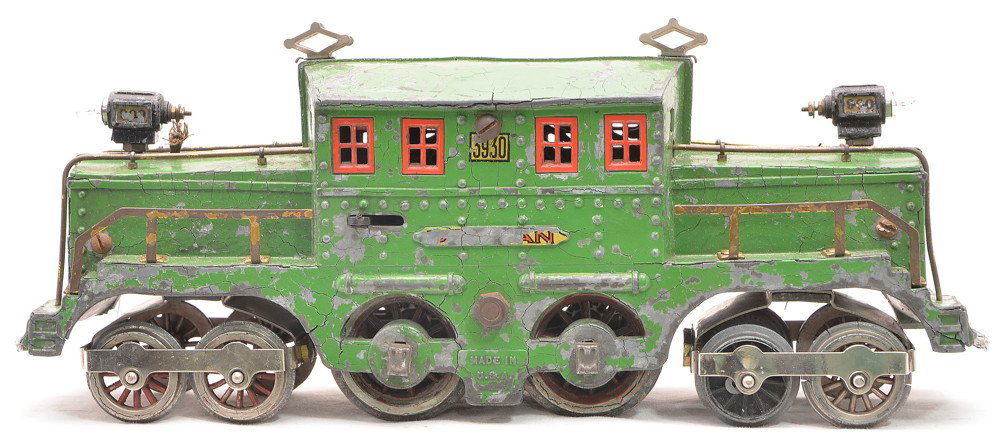 Dorfan 3930 Medium Green Loco-Builder Engine: Dorfan prewar wide gauge 3930 medium green Loco-Builder engine with red window frames and Distance Remote control. The die-cast body on the loco is crumbling and is warped.