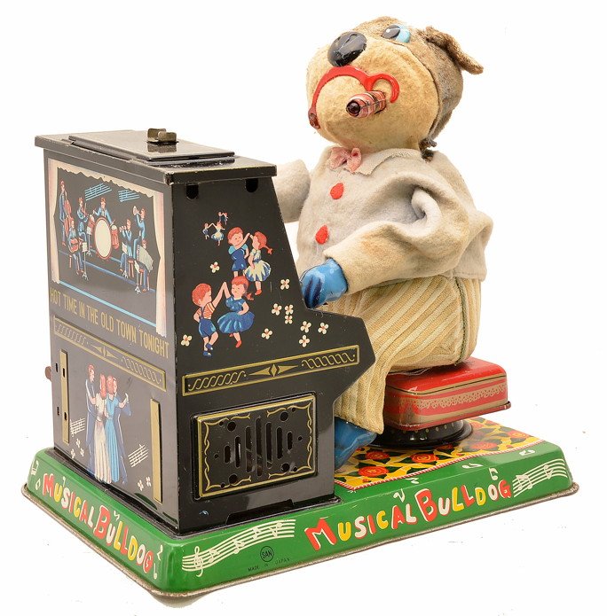 San Japanese Battery Oper. Musical Bulldog Piano: San made in Japan battery operated Musical Bulldog with tin lithographed piano on tin lithographed base, C7.