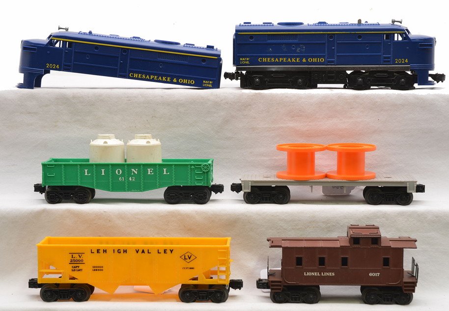 Lionel Freight Set 2024 6142 6042 6176 6017: Lionel postwar freight set no. 11720, circa 1969 including; 2024 Chesapeake & Ohio Alco A unit, 6142 green gondola with two white plastic canisters, 6042 flatcar with two orange cable reels, 6176 yell