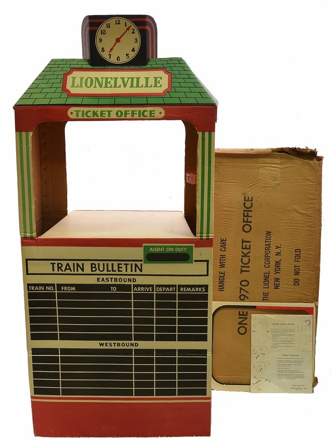 Lionel 970 Cardboard Ticket Office Assembled OB: Lionel postwar 970 cardboard ticket office assembled with instruction sheet and worn OB. The ticket booth is complete but has some discoloration due to age.