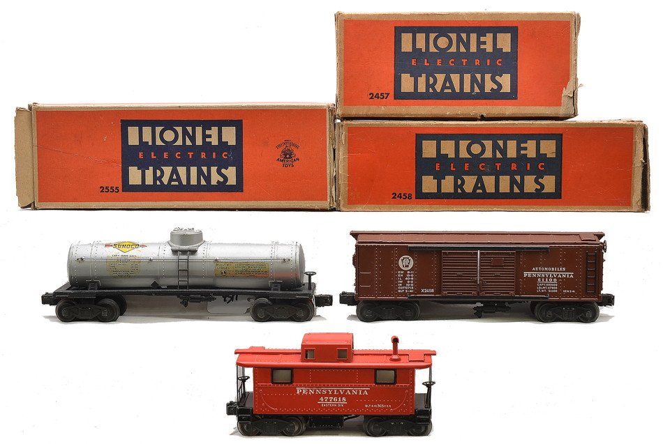 Lionel Freights 2458 PRR 2555 Tank 2457 PRR: Lionel postwar freight cars in worn OBs including; 2458 Pennsylvania automobile car, 2555 silver Sunoco tank car, the harder to find version the a rubber-stamped number 2555 stamped on the underside o