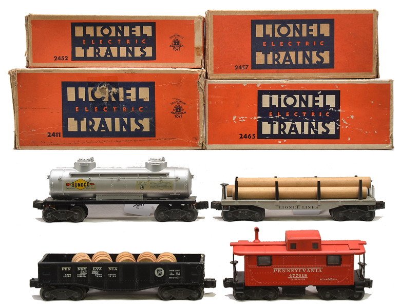 Lionel Postwar Freight Cars 2452 2411 2465 2457: Lionel postwar freight cars in worn OBs including; 2452 black Pennsylvania gondola with five wooden barrels, 2411 flatcar with three wooden logs, 2465 silver Sunoco two dome tank and a 2457 red illumi