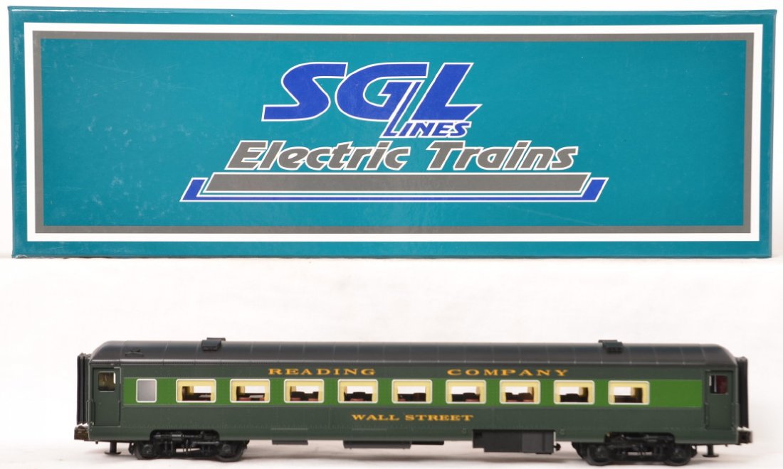 SGL brass Reading turtle back blimp passenger car: SGL modern O gauge brass Reading Wall Street turtle back blimp passenger car in OB. Car is C8 with run time.