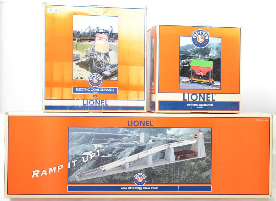 3 Lionel modern coal accessories 97, 497, 456R: Lionel modern O gauge operating coal accessories in OBs. Includes 32921 97 missing controller, 14107 497, and 14105 456R coal ramp. Items are C7-8 condition. OBs have some sun fading and wear.