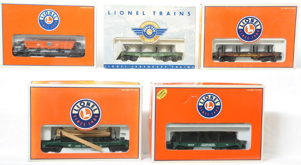 5 Lionel operating log and dump cars 36727, 29806, etc: Lionel modern O gauge operating cars in OBs. Includes 36739 Postwar Celebration Series log dump car, 36764 Westside Lumber log dump car, 36886 Western Pacific coal dump car, 36727 Weyerhaeuser Moe and