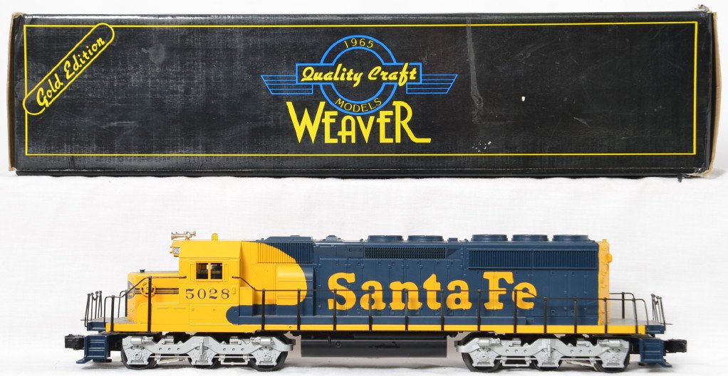 Weaver Santa Fe SD-40-2 diesel locomotive: Weaver modern O gauge Santa Fe SD-40-2 diesel locomotive in OB. Loco is C8 with run time. Loco features horn, electronic reverse, can motors, constant voltage lights, and more. Locomotive original box