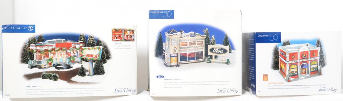 3 Department 56 buildings Lionel, Ford, diner: Department 56 ceramic buildings in OBs. Includes 56.54941 Ford dealership, 56.55008 ShellyÃ•s Diner, and 54947 Lionel Train shop. Buildings appear to be in good condition.