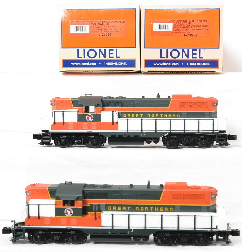 Lionel Great Northern GP-7 power and dummy with Legacy: Lionel modern O gauge 28563 and 28564 GP-7 power and dummy diesel locomotives in OBs. Powered loco features Legacy control, Legacy Railsounds, fan driven smoke unit, Electrocouplers, and much more. Lo