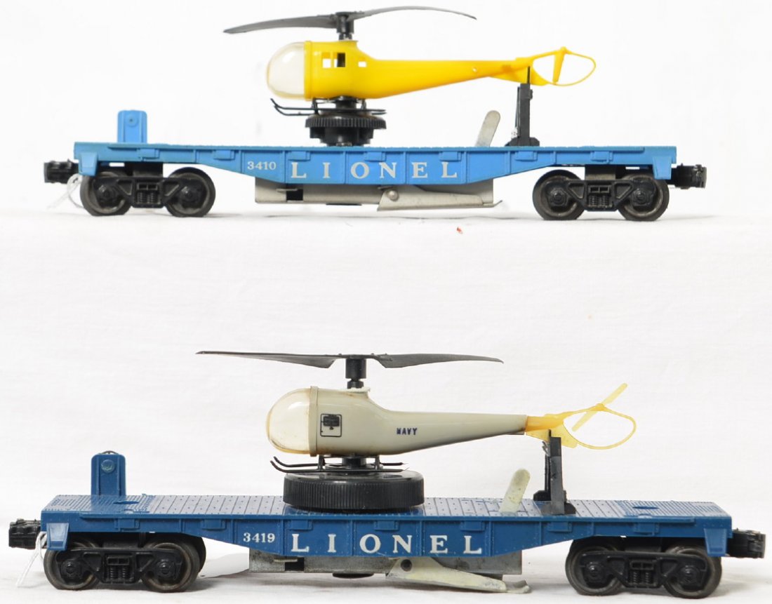 Two Lionel Postwar O gauge 3410 & 3419 operating: Two Lionel Postwar O gauge 3410 & 3419 operating helicopter flat cars, both with original undamaged helicopters, C6. The 3419 is a more odd color than normally seen for this car.