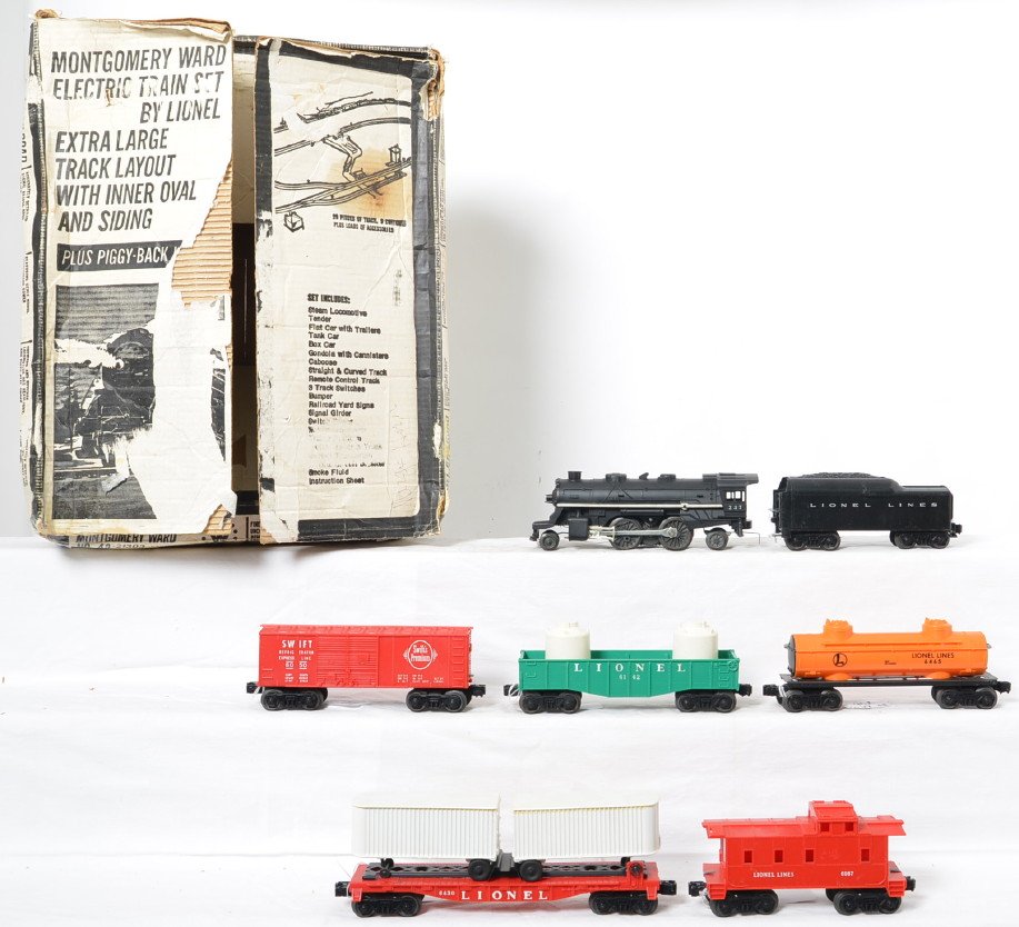 Lionel Postwar O gauge Montgomery Wards 48-21303 19546: Lionel Postwar O gauge Montgomery Wards 48-21303 19546 set in original box. Set consists of 237 steam locomotive, 1103T tender, 6431 flat car with white piggyback trailers and a Midgetoy semi tractor,